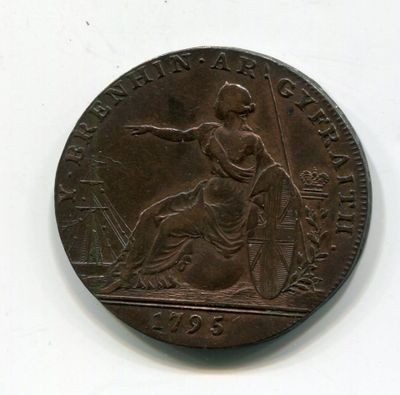 une vieille pièce de monnaie sur laquelle figure l'effigie d'une femme
