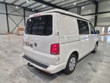 a white van that is parked inside of a building