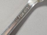 a spoon that has a spoon on it with a name on it