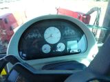 a close up of a car dashboard with a clock on it