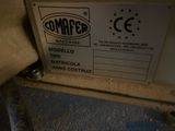 a sign on the side of a machine that says commarser