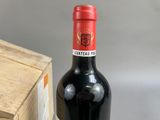 a bottle of wine that is sitting next to a box