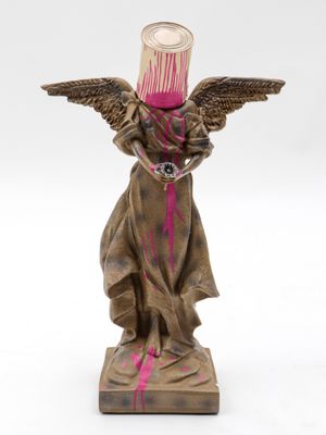 an image of a statue of an angel with pink paint on it