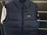 the vest is hanging on a rack in the store