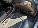 the interior of a car with the door open and the driver ' s seat down