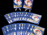 pokemon trading card game set with cards and stickers on a black background