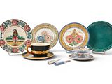 five plates and a cup on the table