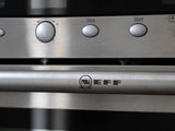 a close up of a stainless steel oven with buttons on it