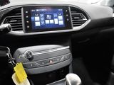 the interior of a car with a steering wheel and dashboard controls