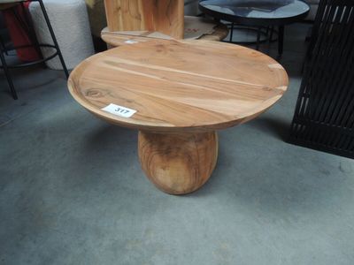 a wooden table with a label on it in a store