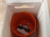 a box with a toy inside of it on the floor