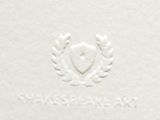 a white card with a heart and laurels on it