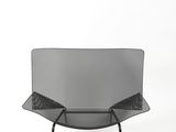 a black chair with a mesh back and legs on a white background