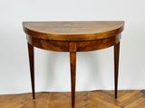 an image of a wooden table with a curved top on a parquet floor