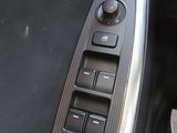 a close up of a car ' s dashboard with buttons and controls