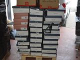many boxes stacked on top of each other in a garage