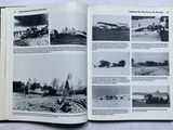 an open book with pictures of military planes in it