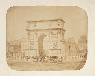 an old photo of a horse and buggy in front of a building
