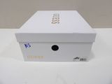 a white box that has a gold logo on it