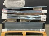 a lot of different types of mattresses stacked on a pallet