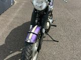 a motorcycle that is parked on the side of the road