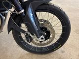 a close up of a motorcycle tire on the ground