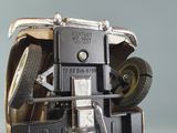 a close up of a toy car with a wheel on it
