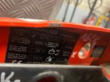 a close up of a red box with a black label on it
