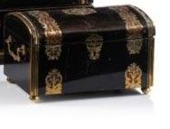 two black and gold boxes with gold decorations on them on a white surface