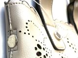 a close up of a pair of shoes with holes on them