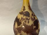 a vase that has a brown and yellow design on it