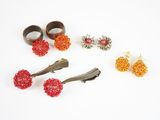 several pieces of jewelry are arranged on a white surface