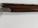 a rifle mounted on the wall in the room