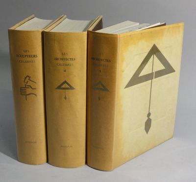 three books sitting on top of each other on a white surface