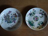 two plates that are sitting on a wooden table