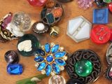 a table with many different types of jewelry on it