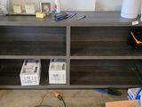 a shelf with a bunch of items on it in a room