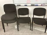 three black office chairs sitting in front of a white board