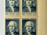 four stamps with portraits of presidents on them on a piece of paper