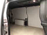 a white van that is parked inside of a garage