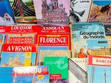 several books are stacked on top of each other on a table