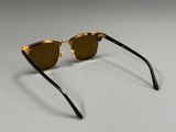 a pair of sunglasses on a white surface