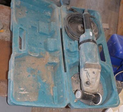 a blue tool box with a hammer inside of it