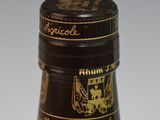 a close up of a bottle of alcohol on a table