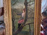 tableau représentant une femme assise sur une branche d'arbre, dans un cadre doré