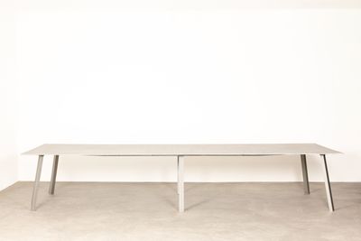an image of a white table in a room with a white wall