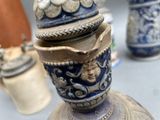 many vases that are sitting on a table