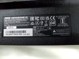 the back side of a laptop with a sticker on it