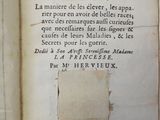 an old book with writing on it sitting on a table