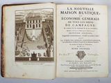 an open book with a picture of a building in the background